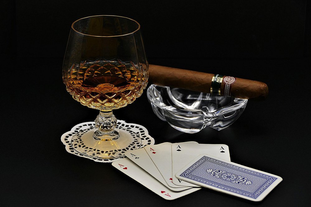 cognac cigar and playing cards